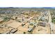 Expansive aerial view of community homes with desert landscape and mountain backdrop at 28213 N Holly Rd, San Tan Valley, AZ 85143