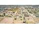 Panoramic aerial view of homes with spacious lots in a desert community with mountains at 28213 N Holly Rd, San Tan Valley, AZ 85143