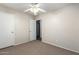 Bedroom with neutral walls, carpeted floor, ceiling fan, and a closet at 28213 N Holly Rd, San Tan Valley, AZ 85143