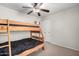 Bedroom featuring carpeted floors, bunk beds, and ceiling fan at 28213 N Holly Rd, San Tan Valley, AZ 85143