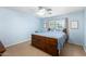 Cozy bedroom featuring wood frame bed, plush carpet and ample natural light at 28213 N Holly Rd, San Tan Valley, AZ 85143