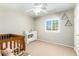 Bedroom with beige walls, carpeted floor, ceiling fan and furniture at 28213 N Holly Rd, San Tan Valley, AZ 85143