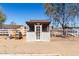 Exterior view of chicken coop with picket fence and surrounding pens at 28213 N Holly Rd, San Tan Valley, AZ 85143