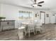 Bright dining area featuring a table with chairs and natural light from a large window at 28213 N Holly Rd, San Tan Valley, AZ 85143