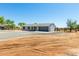 Quaint single-story home with a gravel drive and yard, plus rustic perimeter fence at 28213 N Holly Rd, San Tan Valley, AZ 85143