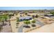 Charming home featuring an attached garage, mature landscaping, and a gravel driveway at 28213 N Holly Rd, San Tan Valley, AZ 85143