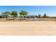 This cozy home is located in a quiet neighborhood with mature trees and landscaping at 28213 N Holly Rd, San Tan Valley, AZ 85143