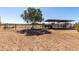 Spacious horse shelter with fenced in area, perfect for equine comfort at 28213 N Holly Rd, San Tan Valley, AZ 85143