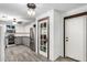 Kitchen features stainless steel appliances, wood countertops, white upper cabinets, pantry and wood-look flooring at 28213 N Holly Rd, San Tan Valley, AZ 85143