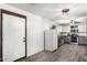 Practical kitchen with white appliances, updated flooring, and generous cabinet space at 28213 N Holly Rd, San Tan Valley, AZ 85143
