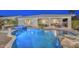 Gorgeous backyard with a private pool, hot tub, covered patio and an outdoor seating area perfect for entertaining at 2842 N 168Th Ave, Goodyear, AZ 85395