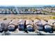 Aerial view of tan colored homes in a residential community at 3547 W Whispering Wind Dr, Glendale, AZ 85310