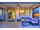 Comfortable covered patio with outdoor seating and a view of the backyard at 3841 E Oxford Ln, Gilbert, AZ 85295