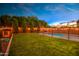Nighttime shot of backyard with pool and lights at 3841 E Oxford Ln, Gilbert, AZ 85295