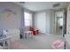 This bedroom has a rainbow wall decoration, a closet and a table with chairs at 3841 E Oxford Ln, Gilbert, AZ 85295