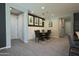 Bright dining room with modern decor, stylish lighting, and wood-look tile flooring at 3841 E Oxford Ln, Gilbert, AZ 85295