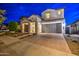 Inviting two-story home with a spacious driveway and a neatly landscaped front yard, perfect for families at 3841 E Oxford Ln, Gilbert, AZ 85295