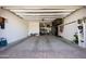 Spacious garage with ample storage solutions, shelving, and room for multiple vehicles at 3841 E Oxford Ln, Gilbert, AZ 85295