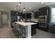 Modern kitchen with stainless steel appliances and a large island, ideal for cooking at 3841 E Oxford Ln, Gilbert, AZ 85295
