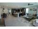 Open-concept living space featuring a kitchen island, dining area, and comfortable living room at 3841 E Oxford Ln, Gilbert, AZ 85295