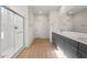 Open bathroom with a walk-in shower and double vanity at 42855 W Palo Abeto Dr, Maricopa, AZ 85138