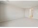Large bedroom with neutral carpet and white walls at 42855 W Palo Abeto Dr, Maricopa, AZ 85138