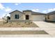 Inviting single-story home with a low-maintenance desert landscape and neutral color palette at 42855 W Palo Abeto Dr, Maricopa, AZ 85138