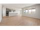 Open-concept kitchen with gray cabinetry, island, and stainless steel appliances, perfect for entertaining at 42855 W Palo Abeto Dr, Maricopa, AZ 85138