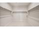 Spacious walk-in closet with carpeting and shelving at 42855 W Palo Abeto Dr, Maricopa, AZ 85138
