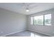 Bedroom featuring a neutral wall, wood-look floor, and window with natural light at 4901 S Calle Los Cerros Dr # 206, Tempe, AZ 85282