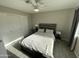 The bedroom has a ceiling fan, a light gray color scheme, and great natural light at 4901 S Calle Los Cerros Dr # 206, Tempe, AZ 85282