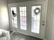 Bright entryway with glass-paneled door and hat rack, welcoming guests at 4901 S Calle Los Cerros Dr # 206, Tempe, AZ 85282
