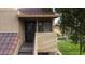 Inviting condo entrance featuring stairs, a tiled roof, and mature tree at 4901 S Calle Los Cerros Dr # 206, Tempe, AZ 85282