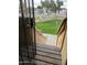 Welcoming front yard view from condo featuring lush grass and desert landscaping at 4901 S Calle Los Cerros Dr # 206, Tempe, AZ 85282