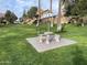 Manicured green space with a picnic table and sunshade to sit, relax and enjoy the outdoors at 4901 S Calle Los Cerros Dr # 206, Tempe, AZ 85282