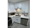 Clean kitchen design with quartz countertop, stainless steel appliances, and black faucet at 4901 S Calle Los Cerros Dr # 206, Tempe, AZ 85282