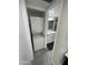 A convenient, stacked washer and dryer located in the bathroom at 4901 S Calle Los Cerros Dr # 206, Tempe, AZ 85282