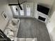 Bright living room with gray wood-look flooring and a modern fireplace at 4901 S Calle Los Cerros Dr # 206, Tempe, AZ 85282