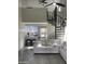 Cozy living room with open kitchen and spiral staircase, offering a unique layout at 4901 S Calle Los Cerros Dr # 206, Tempe, AZ 85282