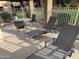 Private patio with lounge chairs and a table offers a comfortable outdoor living space at 4901 S Calle Los Cerros Dr # 206, Tempe, AZ 85282