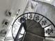 Unique spiral staircase with decorative wrought iron railing leads to a bright living space at 4901 S Calle Los Cerros Dr # 206, Tempe, AZ 85282