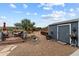 Charming backyard featuring a wood deck, shed, landscaping and ample space for outdoor entertaining at 49011 N 7Th Ave, New River, AZ 85087