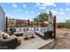 Outdoor lounge area with an sectional couch perfect for relaxing at 49011 N 7Th Ave, New River, AZ 85087