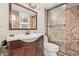 Bathroom featuring sink vanity with a large framed mirror and tiled walk-in shower at 6240 N 16Th St # 37, Phoenix, AZ 85016