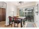 Cozy dining area with bar-height table and seating for two, patio access visible at 6240 N 16Th St # 37, Phoenix, AZ 85016