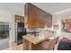 Charming kitchen with granite countertops, stainless steel appliances and breakfast bar with seating at 6240 N 16Th St # 37, Phoenix, AZ 85016