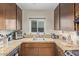 Galley kitchen with granite countertops, stainless steel sink, and under-cabinet lighting at 6240 N 16Th St # 37, Phoenix, AZ 85016