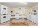 Shared laundry room featuring multiple washers, dryers, and table at 6240 N 16Th St # 37, Phoenix, AZ 85016