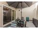 Outdoor patio with umbrella, furniture, and sliding door access at 6240 N 16Th St # 37, Phoenix, AZ 85016