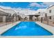 Sparkling community pool with seating area and building views at 6240 N 16Th St # 37, Phoenix, AZ 85016